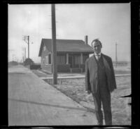 Mr. Waddack poses in front of H. H. West's beach cottage, Venice, about 1903