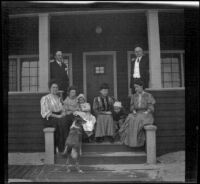 H. H. West's friends and family sit on the porch of his beach cottage, Venice, about 1903