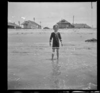 Elizabeth West stands in the surf, Venice, about 1910