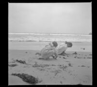Elizabeth and Frances West play in the sand, Venice, about 1910