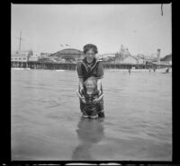 Mary West and Frances West stand in the water wearing bathing suits, Venice, about 1910