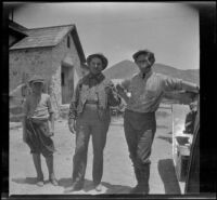 Wilfrid Cline, Jr., Al Schmitz and Glen Velzy posing near a car, Rosamond vicinity, about 1917
