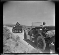 Hamilton's tow car breaks down while towing H. H. West's Buick out of Willow Springs, Mojave vicinity, 1917