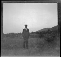 H. H. West poses at the edge of town, Yreka, 1898