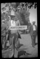 Ralph Hiatt holds a sign at the Iowa Picnic in Bixby Park, Long Beach, 1938
