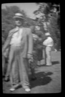 Man poses at the Iowa Picnic in Bixby Park, Long Beach, 1938