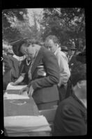 Woman looks at a register at the Iowa Picnic in Lincoln Park, Los Angeles, 1939