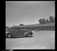 H. H. West's car parked at the Southern Pacific Railroad depot, Battle Mountain, 1942