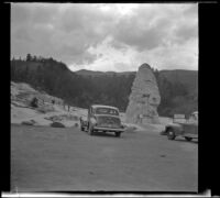 H. H. West's Buick parked in front of Liberty Cap at Mammoth Hot Springs, Yellowstone National Park, 1942