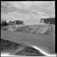 Runoff from Excelsior Geyser spills into the Firehole River, Yellowstone National Park, 1942
