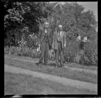 Otis Hutchinson and H. H. West pose in a driveway, Monmouth vicinity, 1942