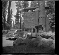 H. H. West's Buick entering at the south entrance, Crater Lake National Park, 1942