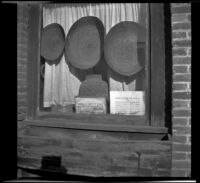 Baskets on display in the window of an old building, Jacksonville, 1942