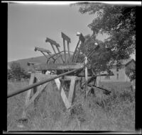 Large water wheel standing in a field, Cave Junction, 1942