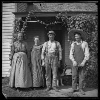 Hattie Temple Corwin, Daisy Corwin, Theodore Corwin and Clyde Corwin pose for a photograph on their farm, Stanton vicinity, 1900