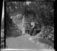 Ellen Lorene (Pinkie) Lemberger sits on a bench in Elysian Park, Los Angeles, 1901