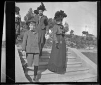 Daisy Conner walks down steps in MacArthur (Westlake) Park along with two children and two women, Los Angeles, about 1900