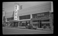Wolfe & Sons furniture building stands along North Broadway, Los Angeles, 1940
