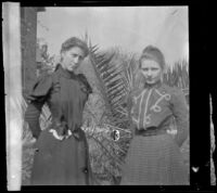 Close-up of Agnes Ebey and Louise Ambrose posing outside the Ambrose home, Los Angeles, about 1894