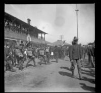 Military troops walking by Southern Pacific Railroad's River Station, Los Angeles, 1898