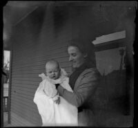 Sadie Russell holds her infant son, Millard Russell, at their home, Los Angeles, 1899