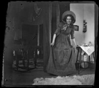Daisy Kellum saunters through her family's home, Los Angeles, about 1899
