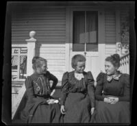 Louise Ambrose, Alice Gordon and Grace Boal sit on the porch steps of the Lacy residence, Los Angeles, about 1900