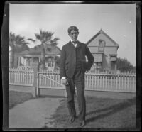 Otto Whitaker stands in his front yard, Los Angeles, about 1898