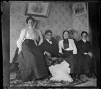 Mertie Whitaker perches on a couch with her brothers, Otto and Guy, and the Brown sisters, Los Angeles, about 1898