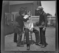 Wilson West shaves John Herwick while Wayne West looks on, Los Angeles, 1898