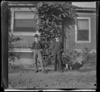 James Pirie and Wayne West pose next to the West's house, Los Angeles, about 1900