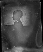 Frances Nichols poses for a silhouette portrait, facing left, Los Angeles, about 1900