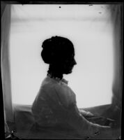 Frances Nichols poses for a silhouette portrait, facing right, Los Angeles, about 1900