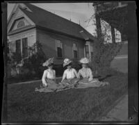 Nettie Davies, Lizzie Chandler, and Mertie Whitaker sit on the West's front lawn, Los Angeles, about 1900