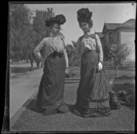 Nella West and Ellen Lorene (Pinkie) Lemberger stand on the West's front lawn, Los Angeles, 1901