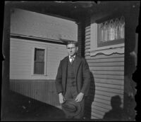Guy West stands on the front porch of the West's house at 240 South Griffin Avenue, Los Angeles, 1902