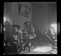 H. H. West's parents and daughters sit in the parlor of the West's house, Los Angeles, about 1909