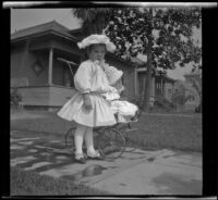 Elizabeth and Frances West pose on a front walk wearing white outfits, Los Angeles, about 1907