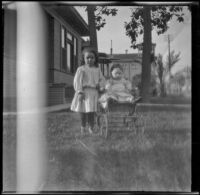 Elizabeth and Frances West on the front lawn of a house, Los Angeles, about 1907