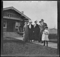 Mary West, Harriet Cline, Ida and Ambrose Teel, Frances West, and unknown woman stand on the front walk of 165 South Harvard Boulevard, Los Angeles, about 1912