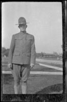 Unidentified solider stands on the West's front lawn, Los Angeles, about 1916