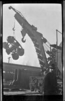 Railroad crane hoists a railroad truck/bogie, New Orleans, about 1917
