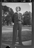 H. H. West Jr. stands in front of the West's house at 2223 Griffin Avenue, Los Angeles, about 1933