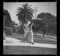 H. H. West Jr. and Josephine Covert stand in front of the West's house, Los Angeles, 1938