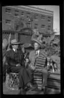 H. H. West and Dr. Bim Smith sit in Smith's backyard, Los Angeles, 1939