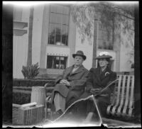 Fred and Mary Lemberger sit on a bench in front of Union Station, Los Angeles, 1940