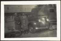 Mertie West and Elizabeth Siemsen stand next to a car outside the Southern Pacific Railroad depot (photo, recto), San Luis Obispo, 1942