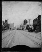 View down a street with cable car tracks, Los Angeles, 1898-1920