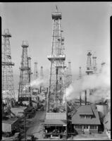 View of the Venice oil field with the ocean on the left, Los Angeles, 1930