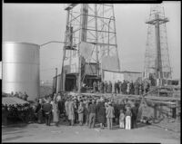 Crowd gathered at an oil well, probably at the Playa del Rey oil field, Los Angeles, 1930-1940